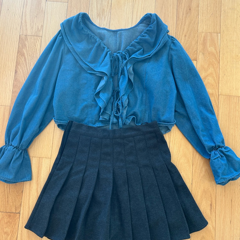 Blue Ruffled Blouse And Black Pleated Skirt Set. 2 Items.